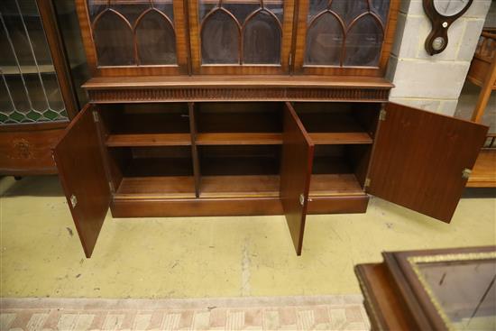 Charles Barr Furniture, A Sheraton-style mahogany library bookcase with swan-neck pediment, W.154cm, D.48cm, H.230cm